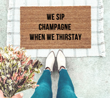 We sip champagne when we thirstay doormat